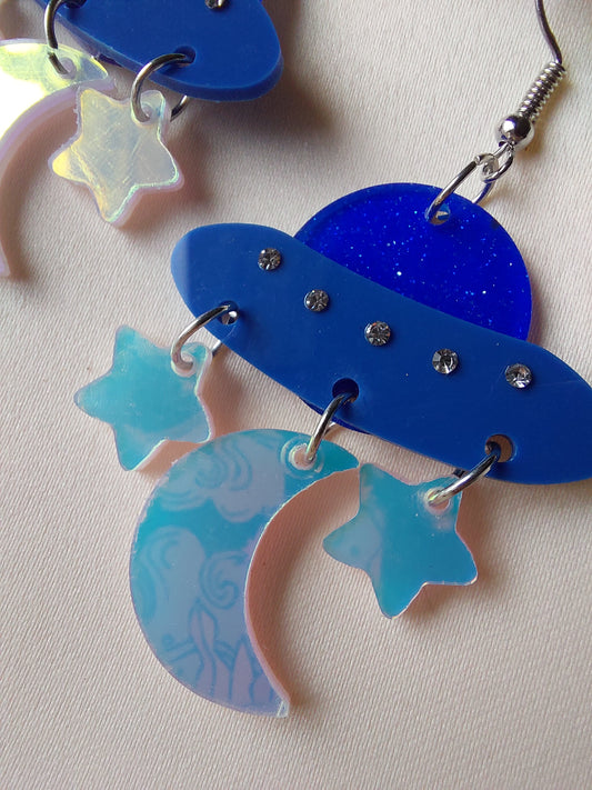 Blue iridescent space ship, moon and star earrings. Silver hooks.