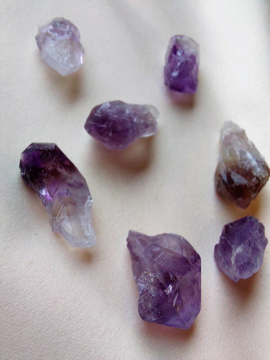 Rough amethyst crystal. Purple and clear. 