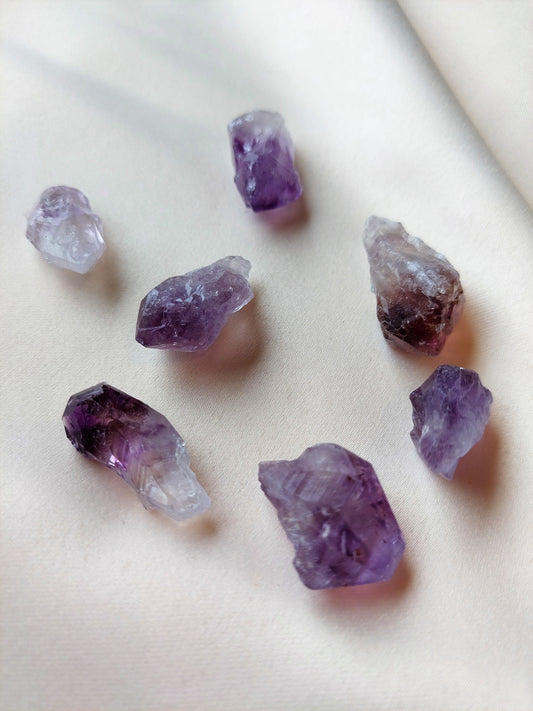 Rough amethyst crystal. Purple and clear. 