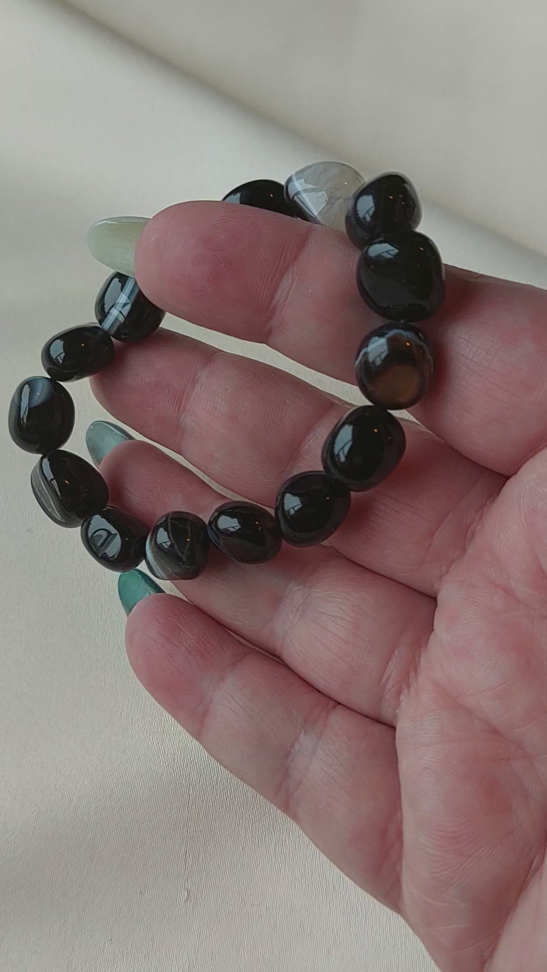 Botswana Agate. Black bracelet with white banding through it. Bracelet is elastic.