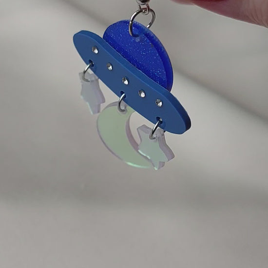Blue iridescent space ship, moon and star earrings. Silver hooks.